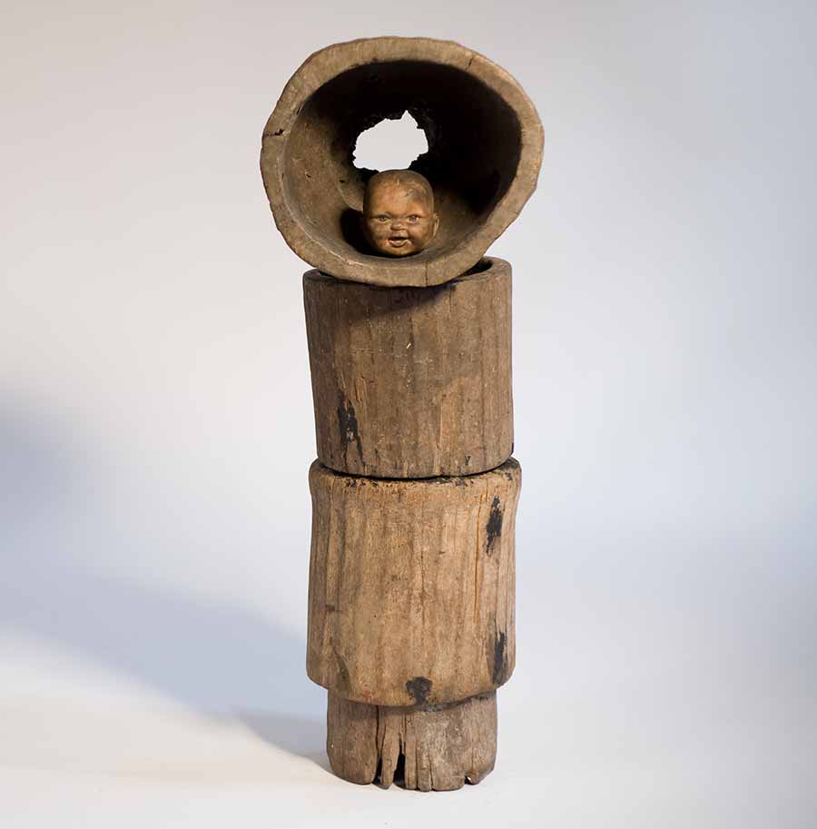 Gérard Quenum, Moine (Monk), 2012. Wood and plastic doll, 97 x 34 x 36 cm. 