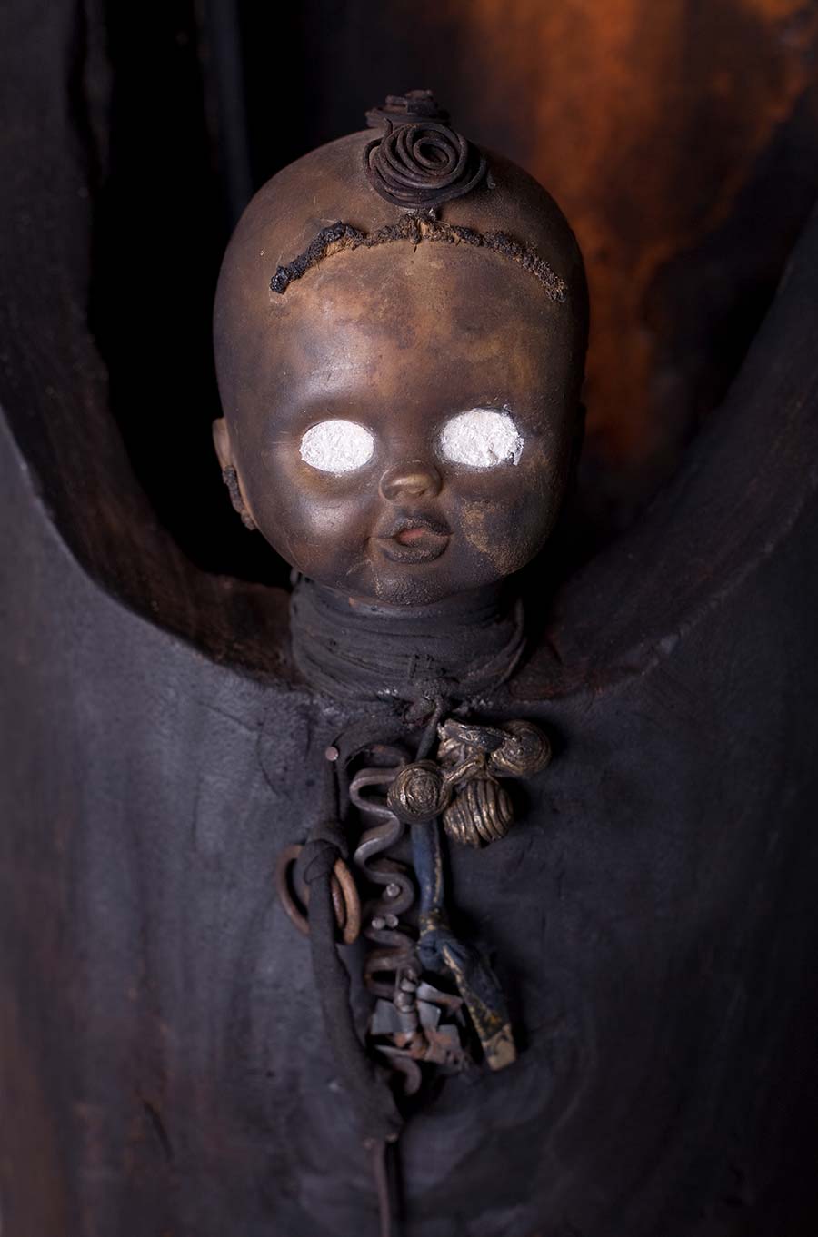 Gérard Quenum, L’Ange (Angel), 2008. Wood, clay, metal, twine and plastic doll, 229 x 28 cm. 