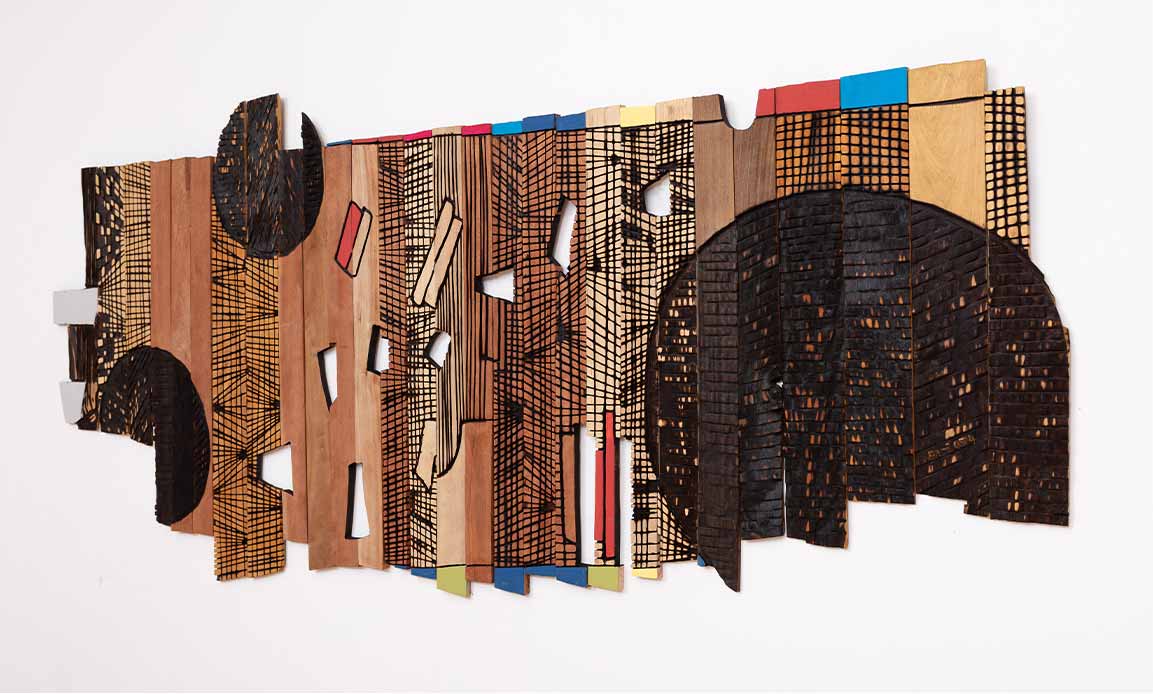 El Anatsui, Moon Fragments, 2024. Tropical hardwood and tempera, 148 x 335 cm. 