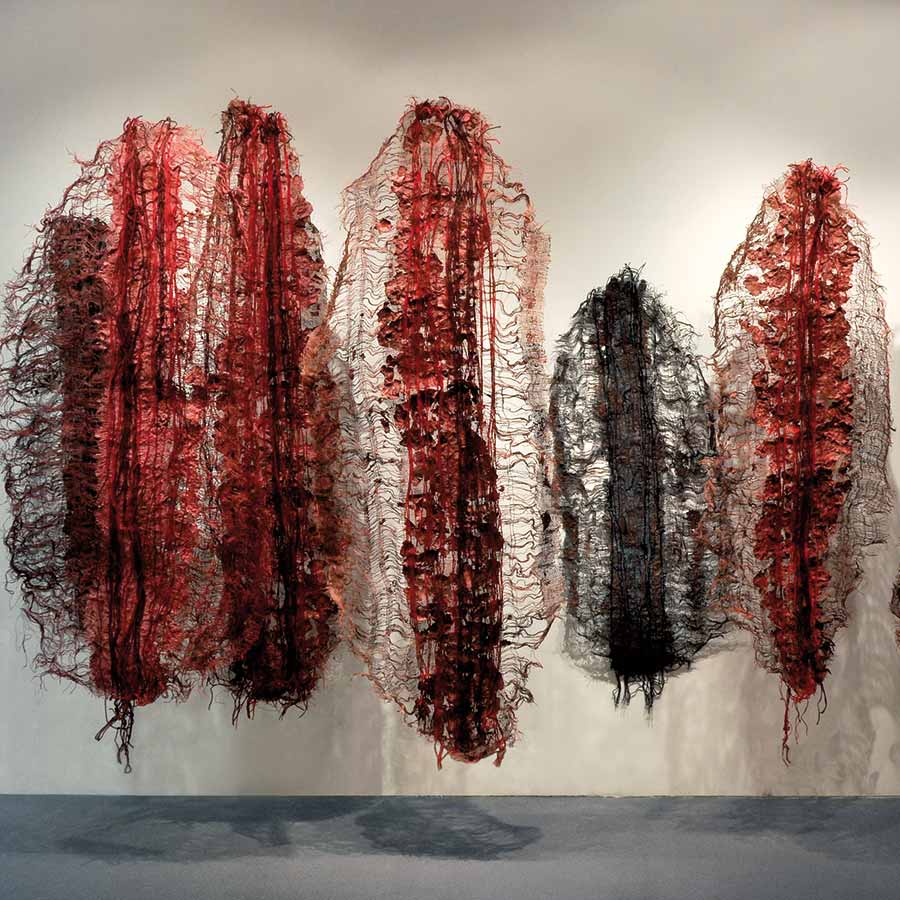 Nnenna Okore, Emissaries, 2009. Handmade paper, dye, burlap, jute rope and yarn, varied dimension approx. 274 x 366 cm.